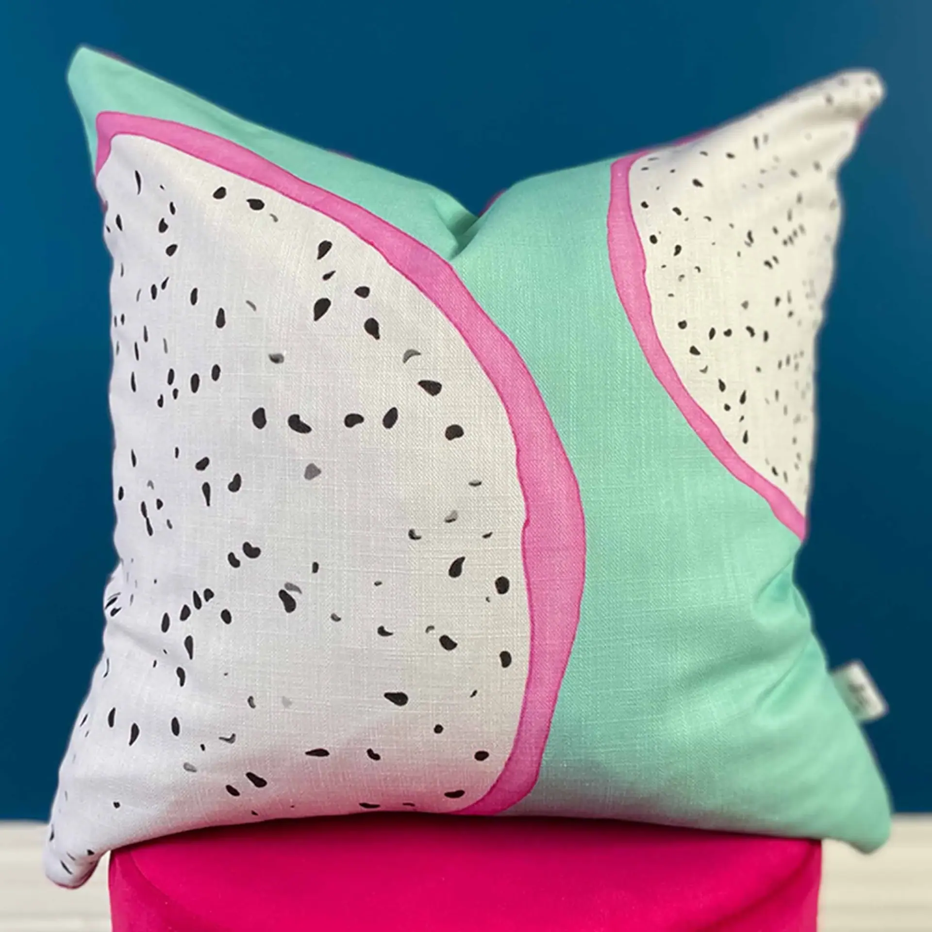 Close view of the Dragon Fruit cushion's illustration, showing the seed detail and pink rind