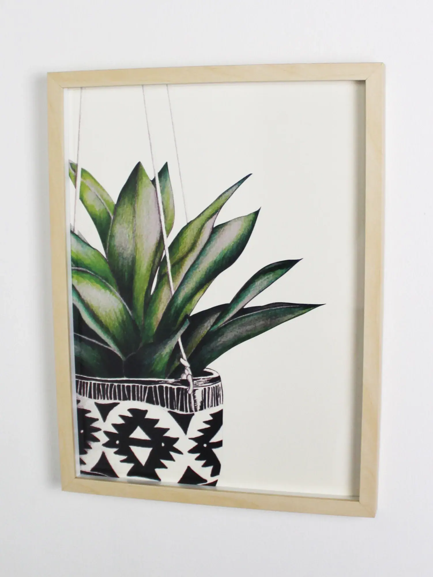 Succulent A3 art print: a large green succulent in an Aztec-patterned pot, in a light wooden frame